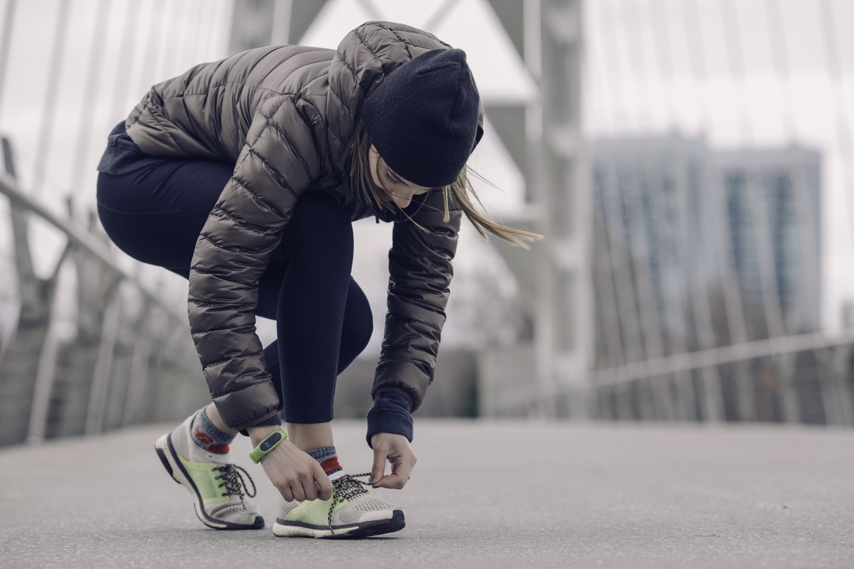 Athlete tying running shoes
