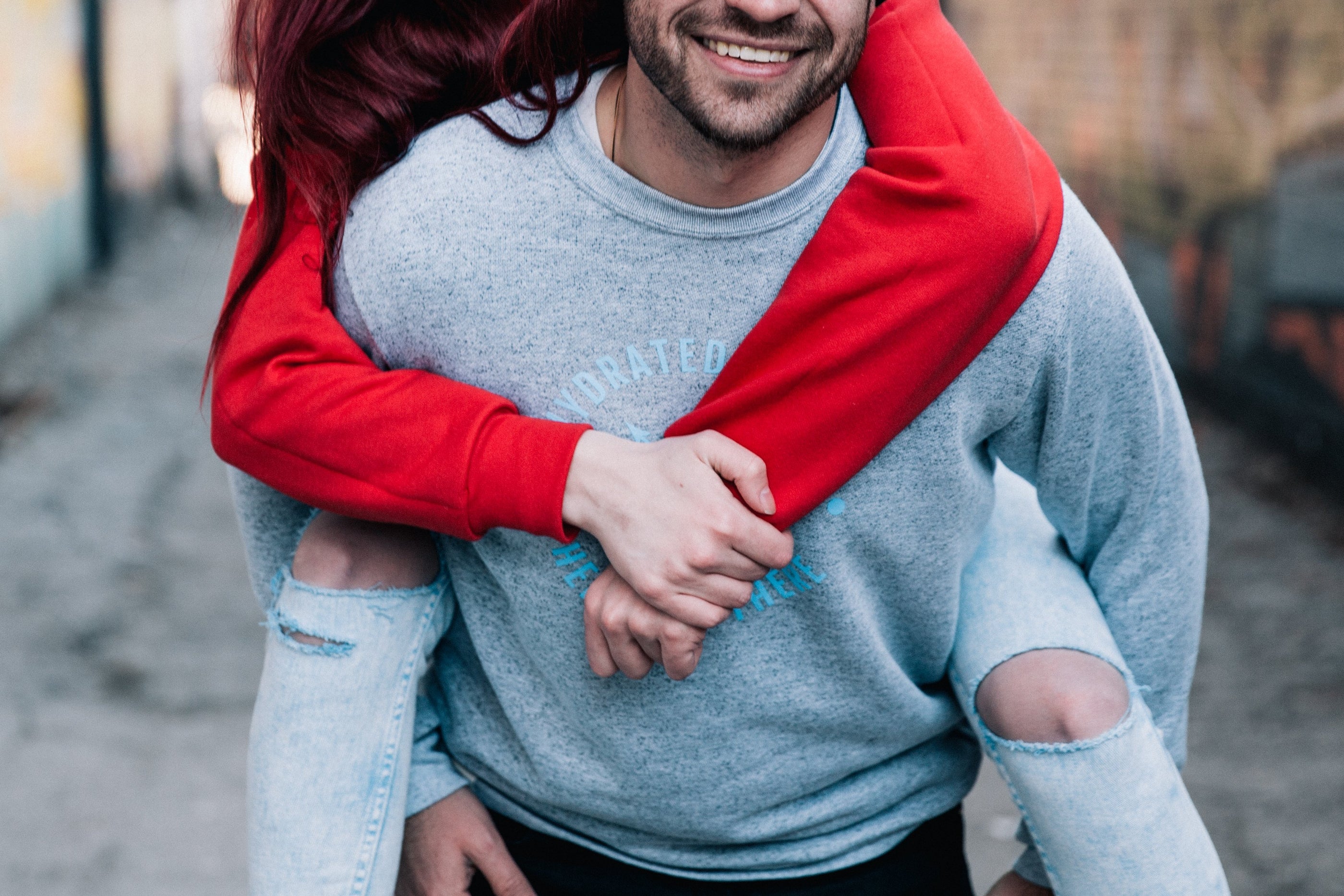 Woman being carried on man's back