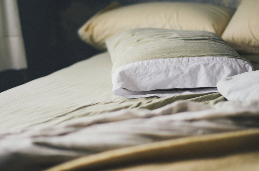 Pillows askew on bed