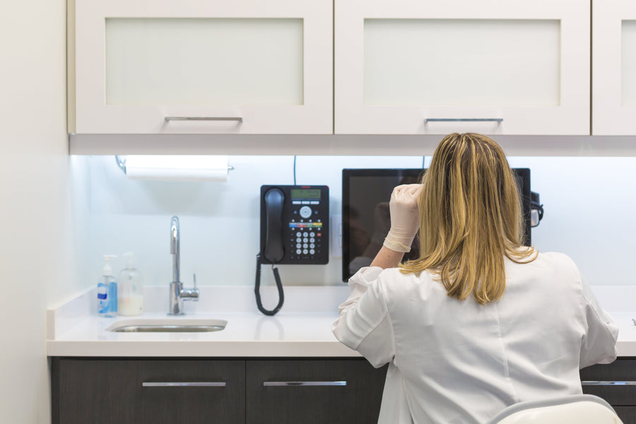 Female doctor looking at computer screen