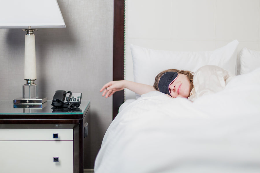 Woman sleeping and wearing eye mask